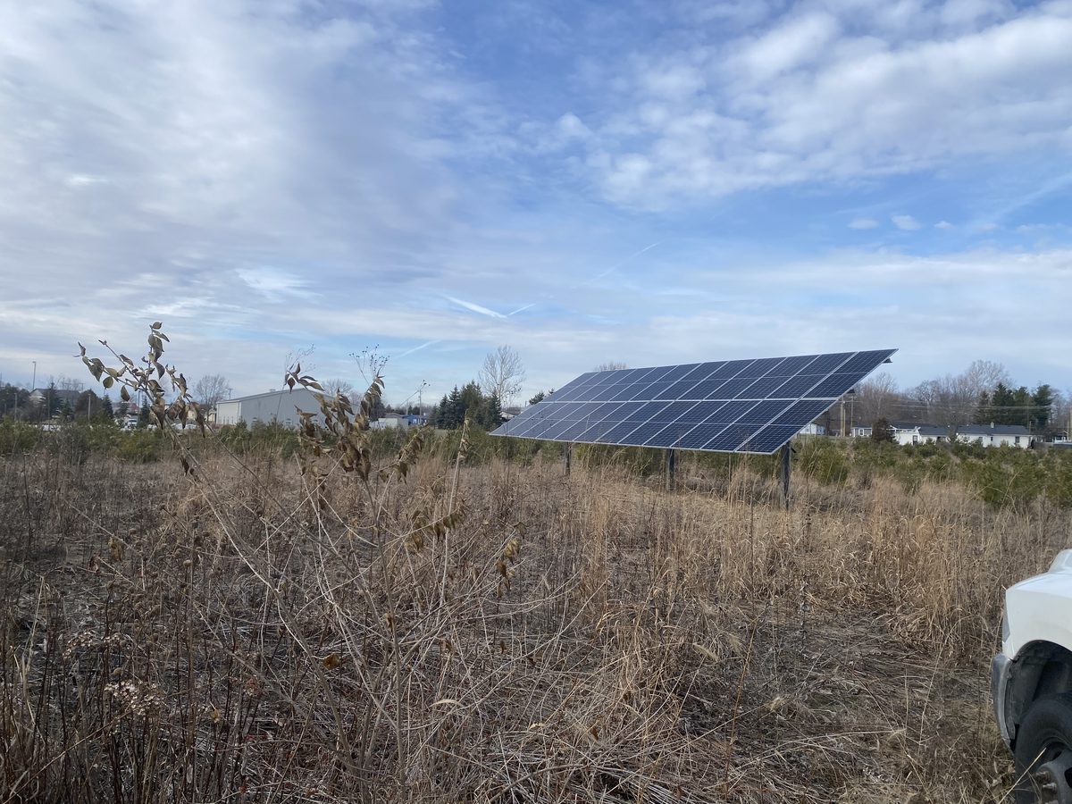 Ground mount solar array on steel posts in an open field