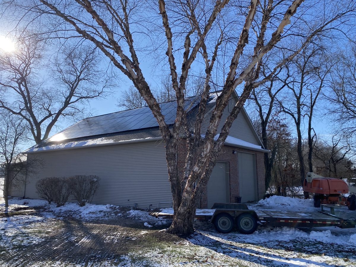Solar array on a large garage roof on a clear winter morning