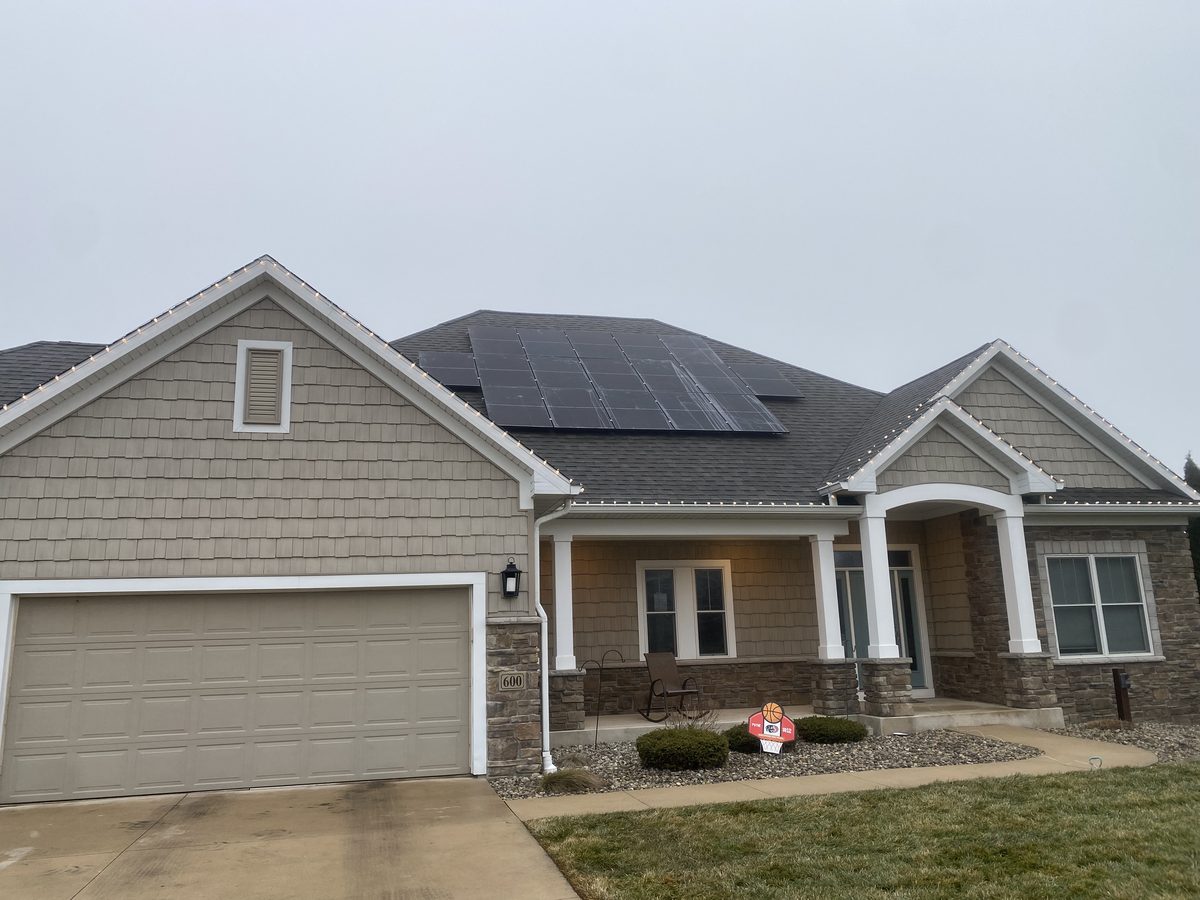 Front of a residential home with a rooftop solar array